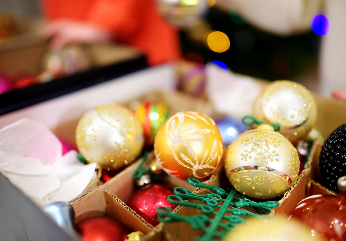 Ornaments and holiday items sitting in a storage box