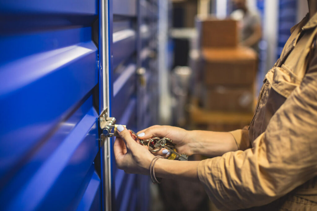 Woman locking self storage unit